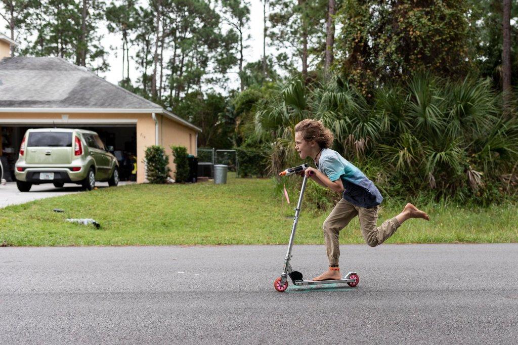 Carson, fleeing on his scooter from Zoey in her "armor."